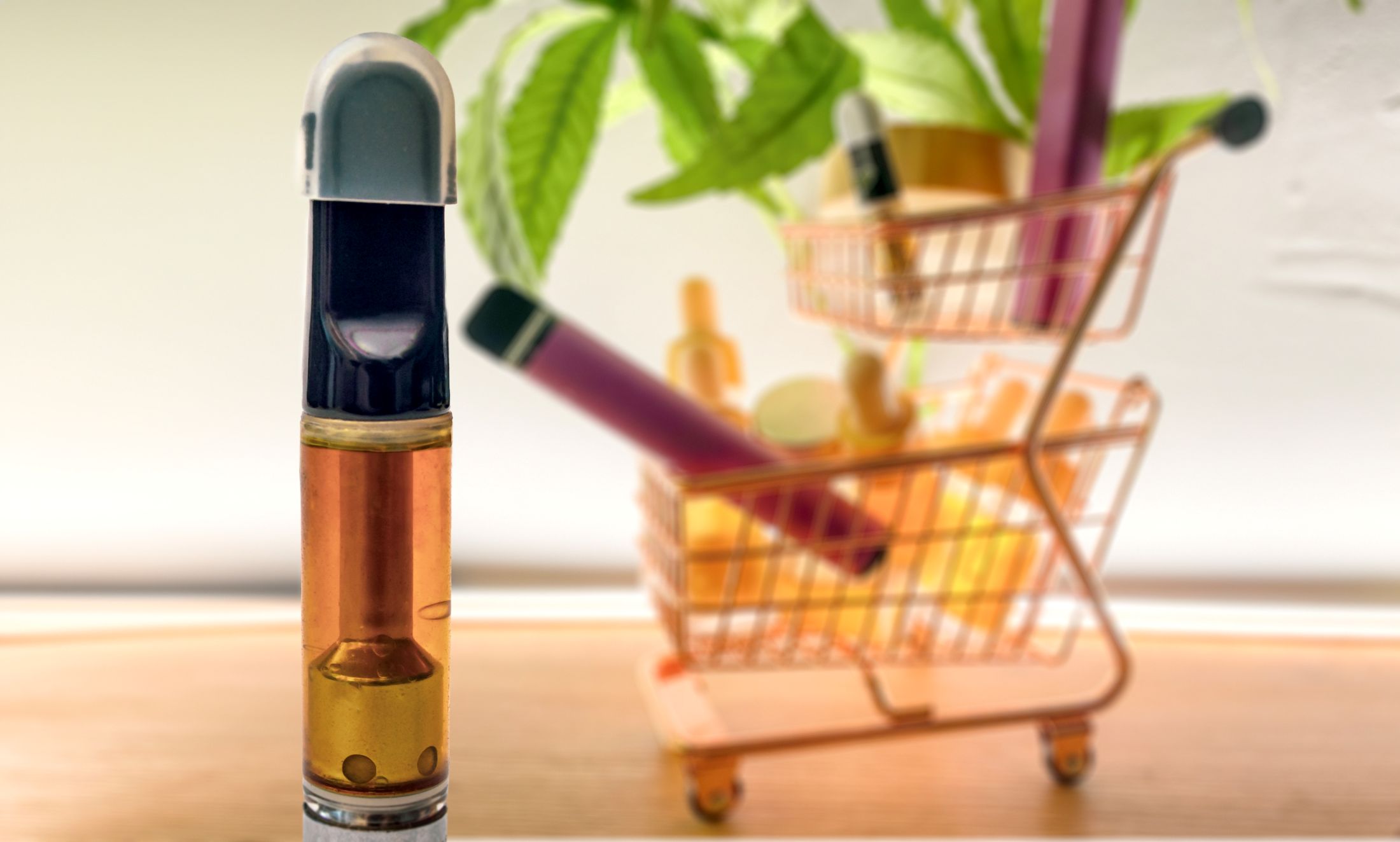 thc-vape-cartridge-and-trolley-with-various-thc-vape-products thc vape cartridge with various thc vape products in cart